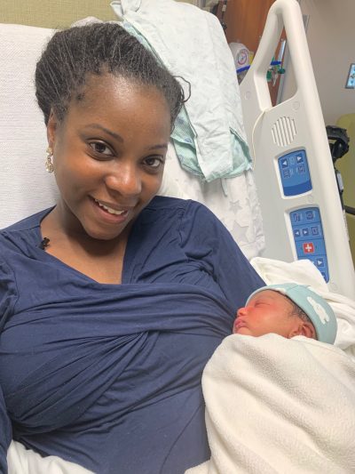 Denise and her new baby in the hospital.