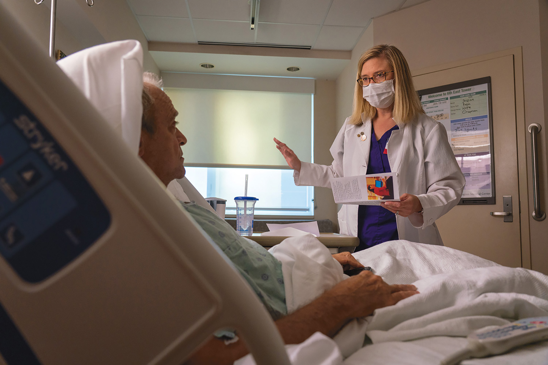 Alice Green with patient in hospital 
