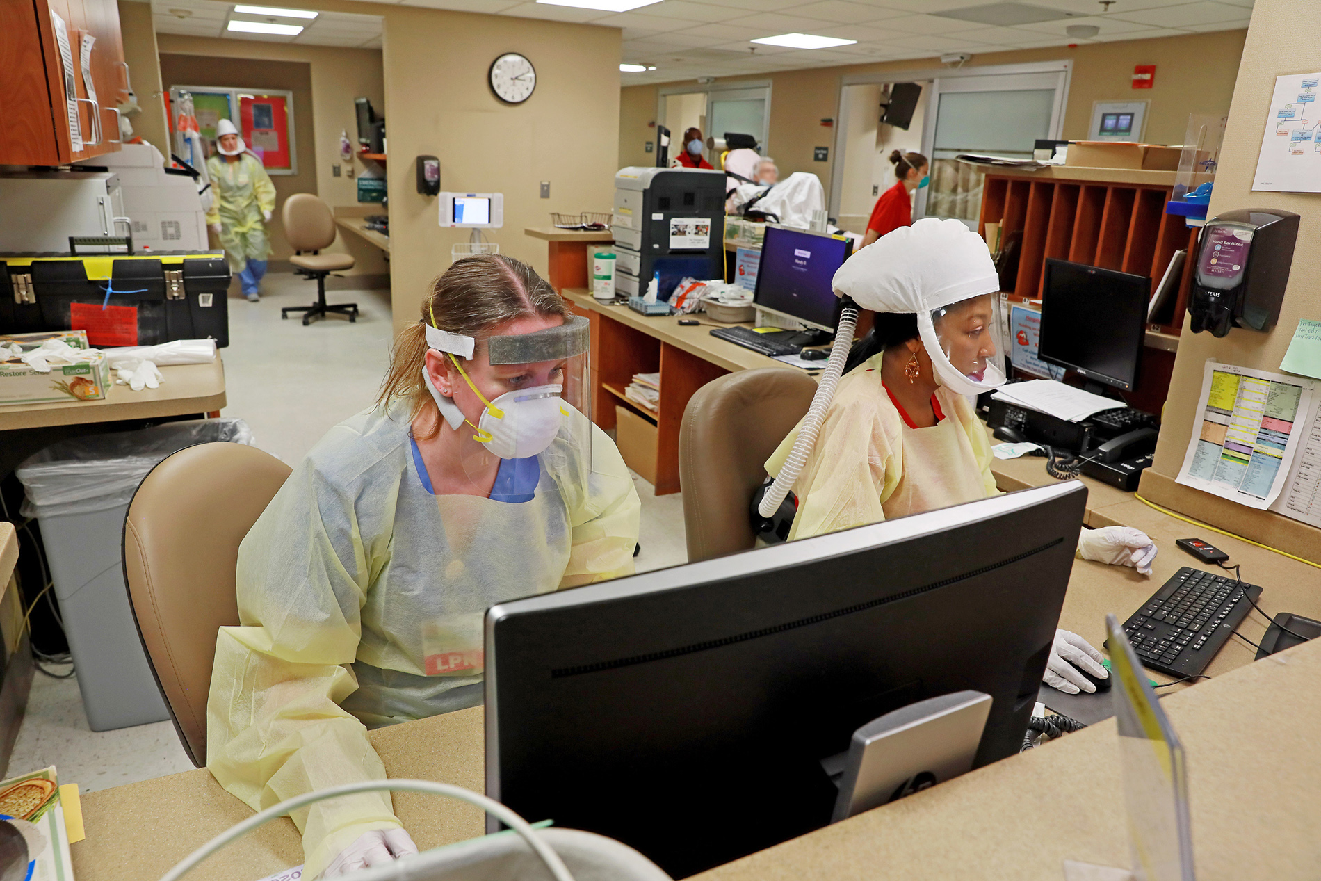 Nurses in COVID protective gear