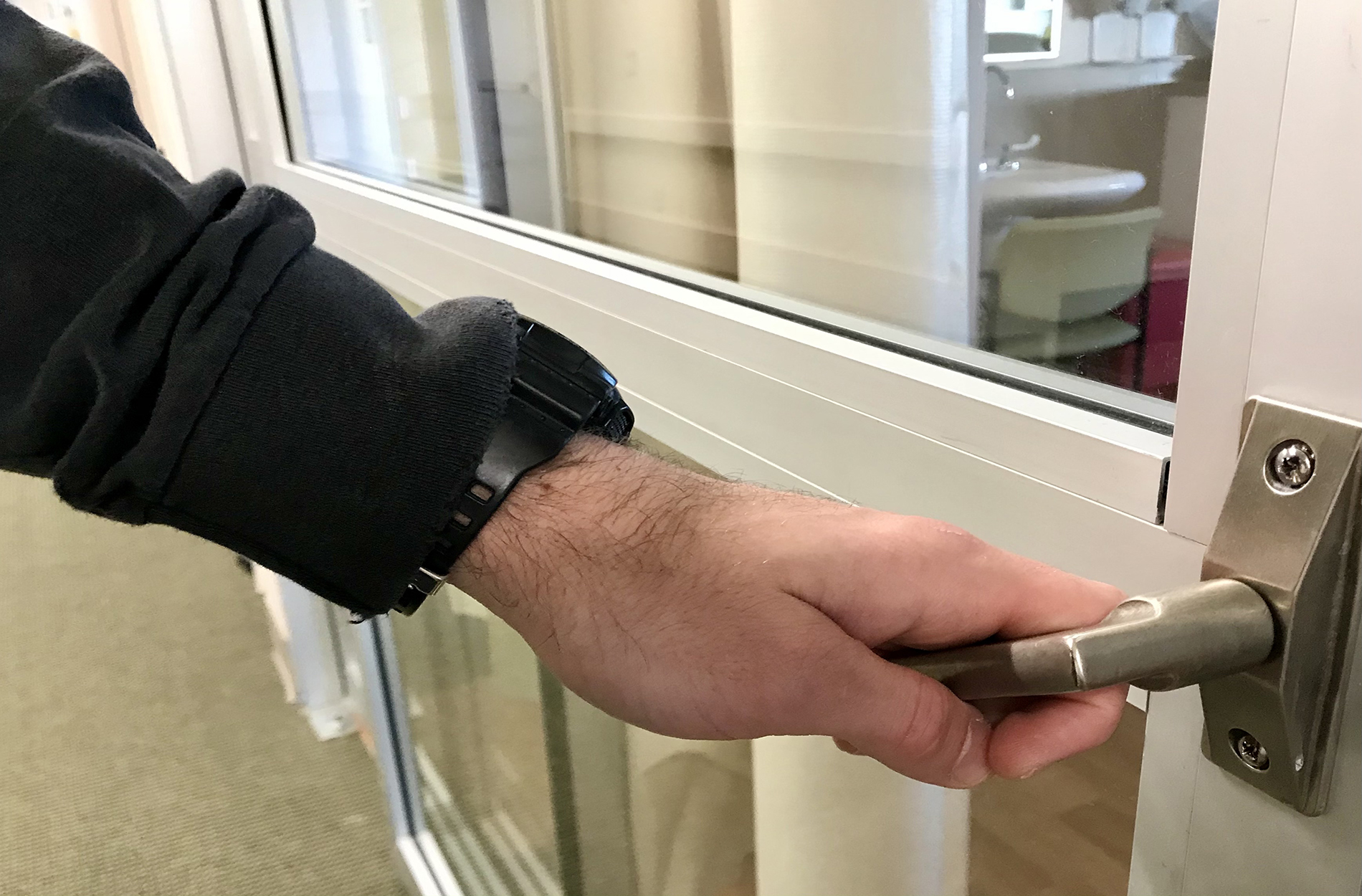 Hand opening patient room door