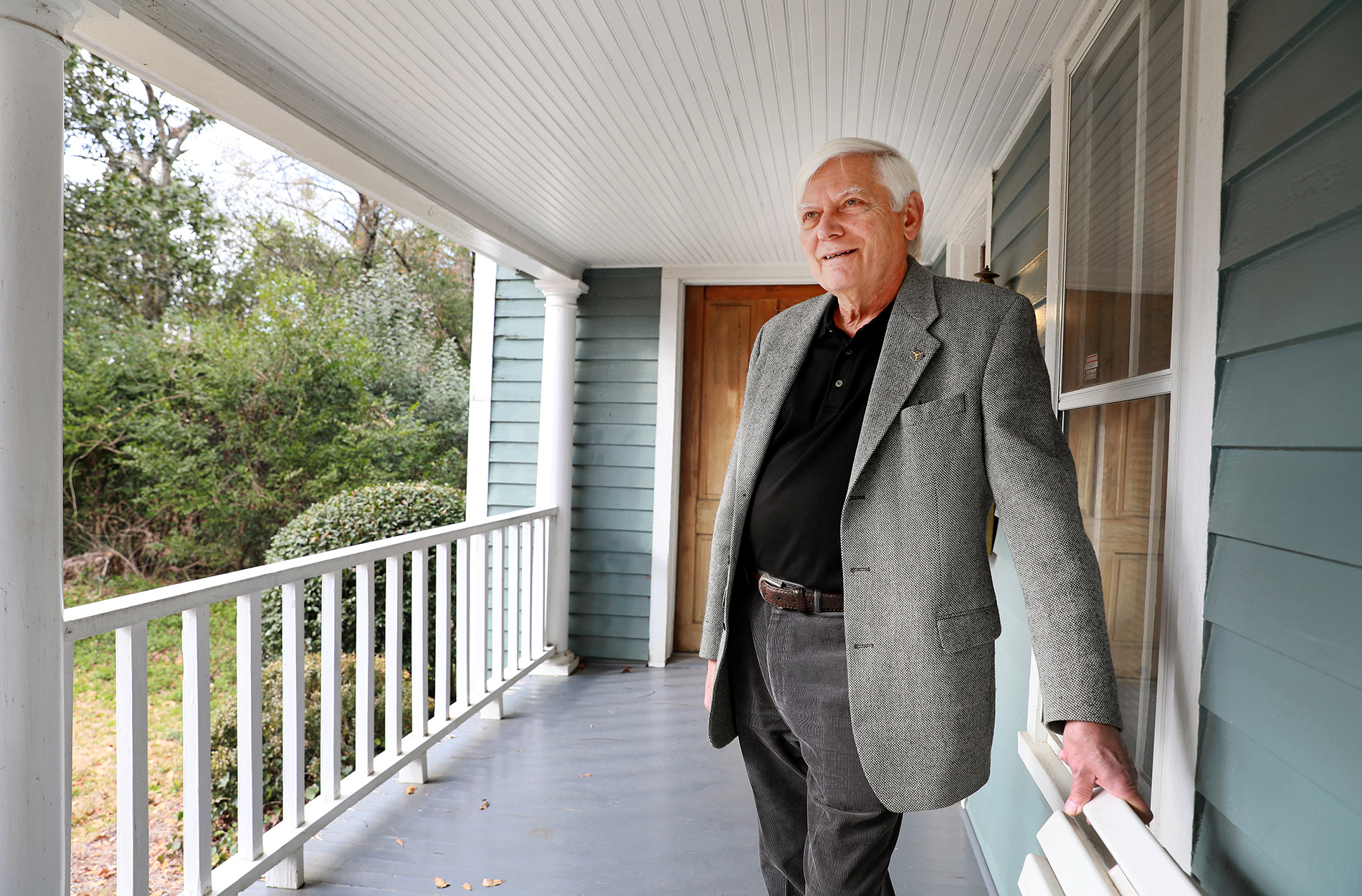 Dr. Harmon on porch of office