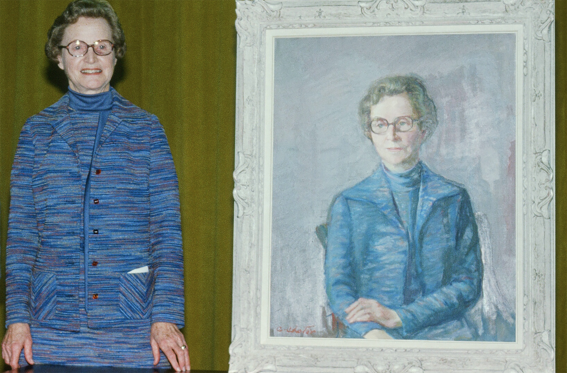 Ms. Medhurst standing next to her portrait