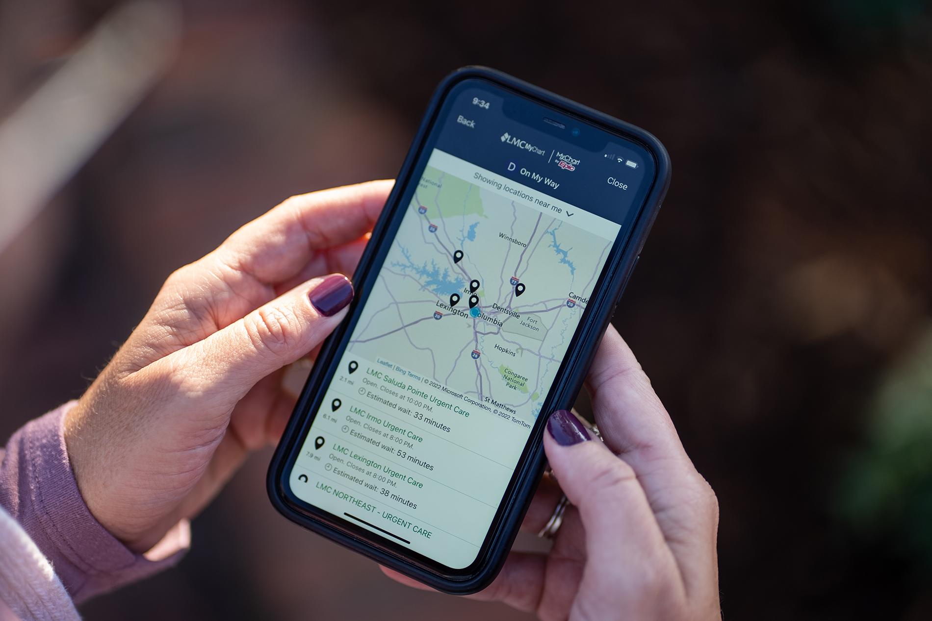 Phone showing urgent care wait times on LMC MyChart