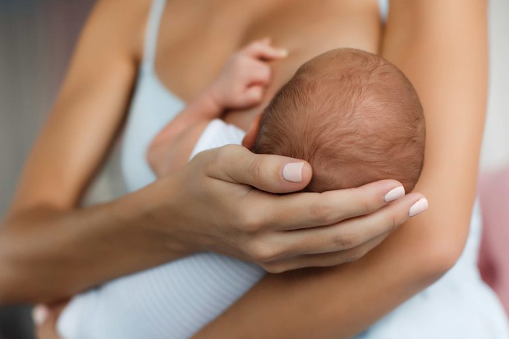 A mother breastfeeding her child.