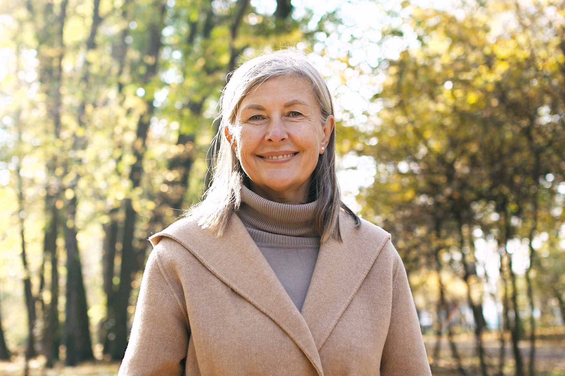 Older women standing outside in coat