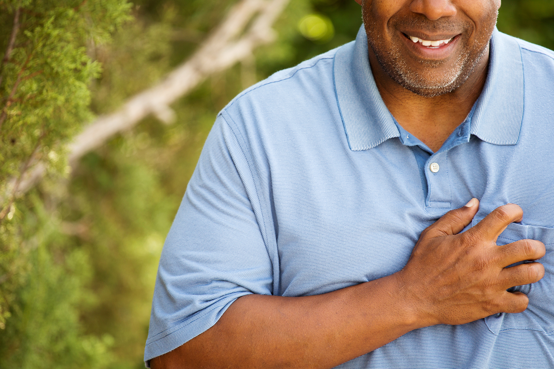 Man clutching chest
