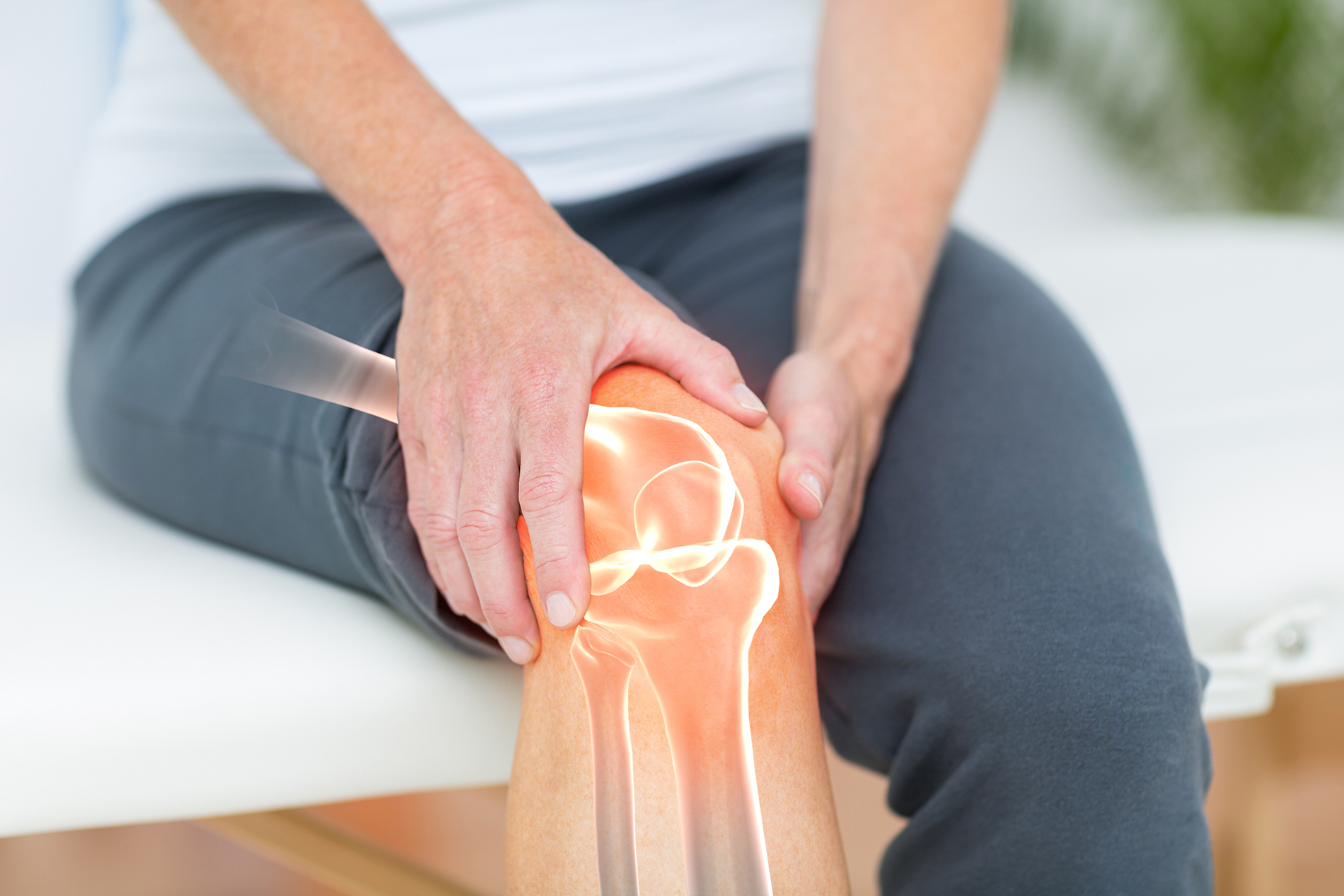 Woman holding knee in pain