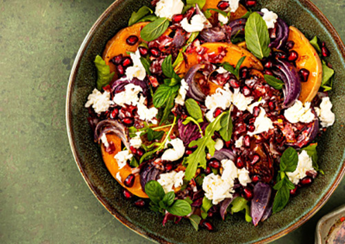 Acorn squash power bowl with cranberries and feta