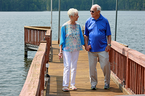 Peggy Lewis and husband walking on dock