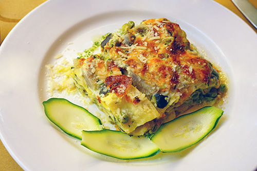 zucchini lasagna on white plate